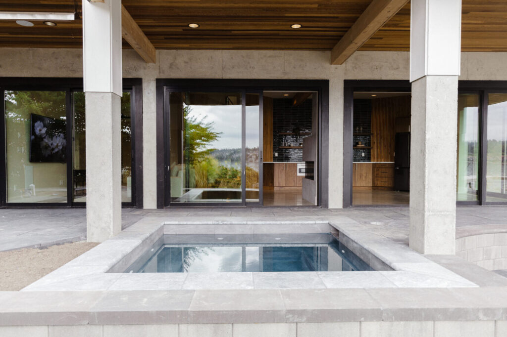 Custom outdoor living space and entry designed for entertaining