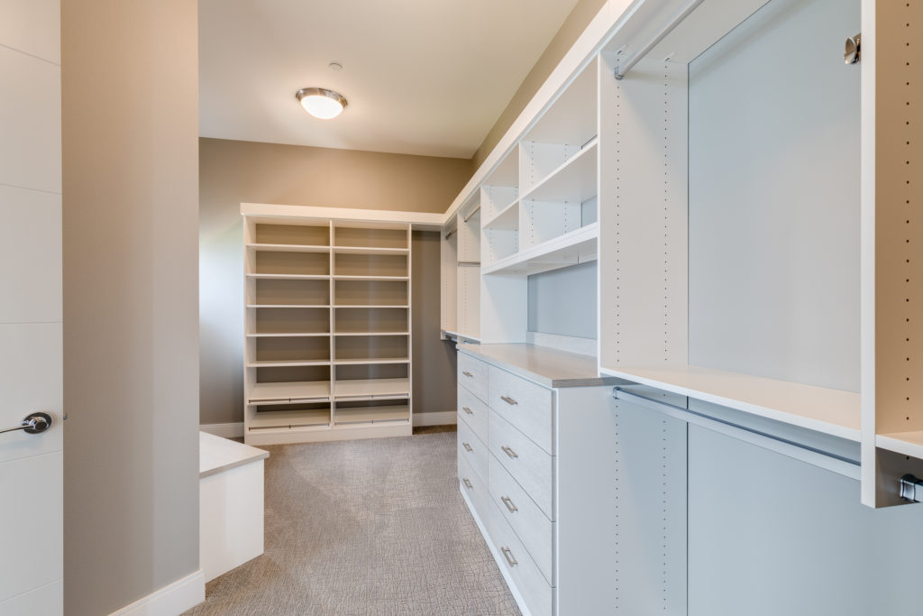 Bright custom walk-in closet and flex space for everyday living