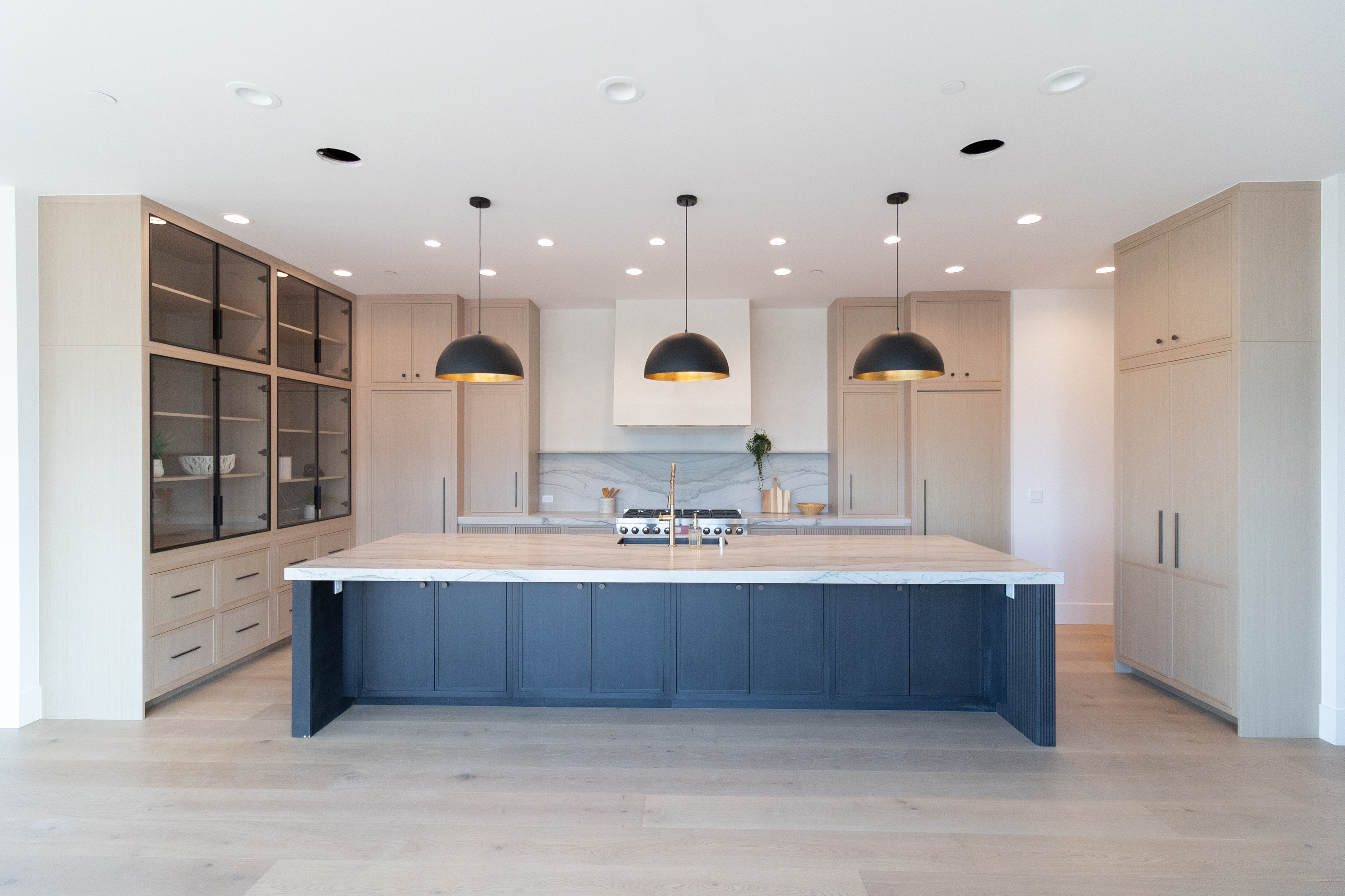 Custom home interior with open living, kitchen, and dining space