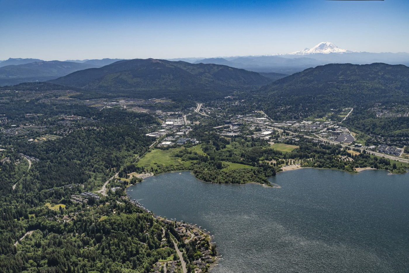 View of Issaquah neighborhood with homes nestled near forested hills